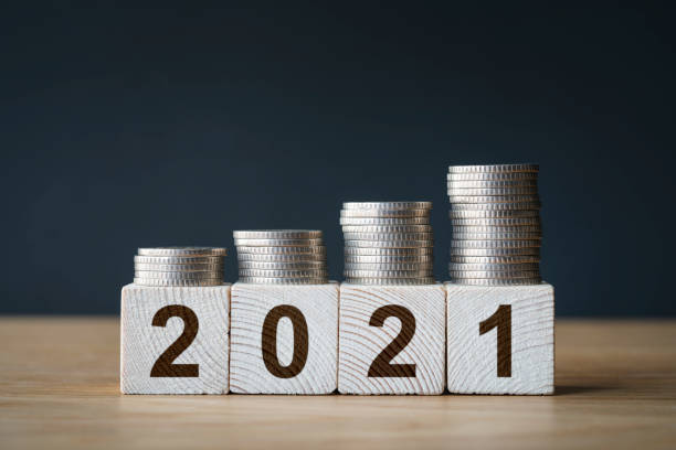 istock Money coins stack stair as step growing growth and wooden cube block 1294321398