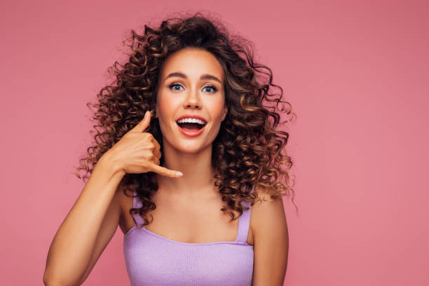 istock Beautiful woman with curly hair gesturing 1294323297