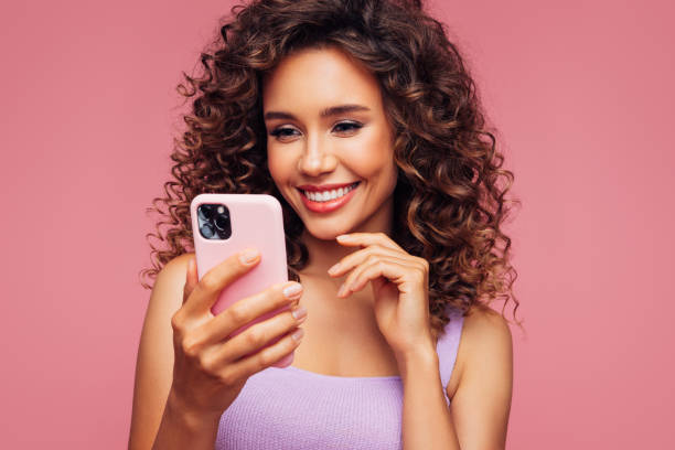 istock Woman In Wireless Earbuds Holding Smartphone 1294323468