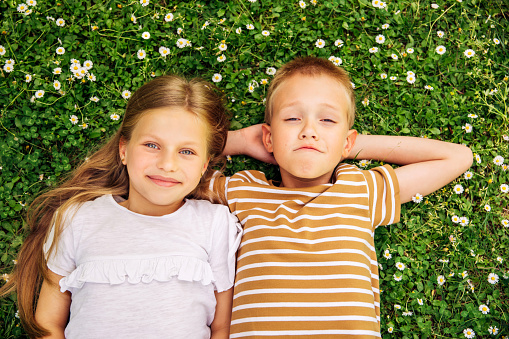Young boy and girl on the grass