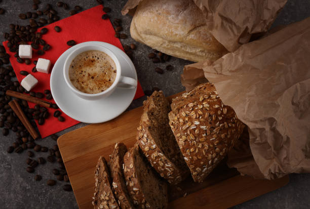 istock A cup of coffee and bread on a granite texture 1294324505