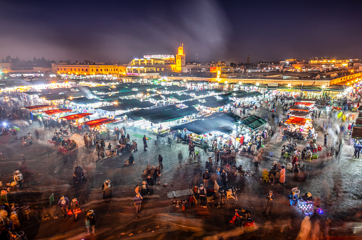 Djemaa El Fna Square with Koutoubia Mosque at night, Marrakech, Morocco