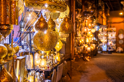 Retail store of traditional Moroccan bronze lamps in Marrakech old town (Medina)