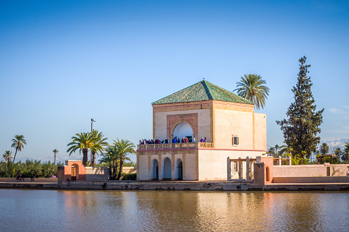 Saadian pavilion, Menara gardens and Atlas mountains in Marrakech, Morocco, Africa