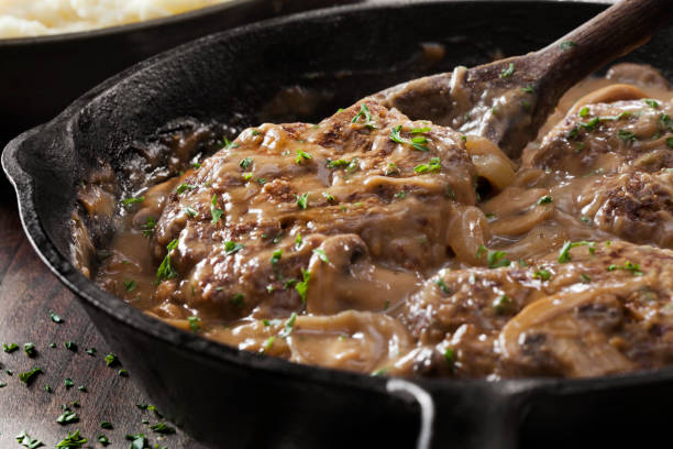 Salisbury Steak in a Rich Mushroom and Onion Gravy with Mashed Potatoes Salisbury Steak in a Rich Mushroom and Onion Gravy with Mashed Potatoes salisbury steak stock pictures, royalty-free photos & images