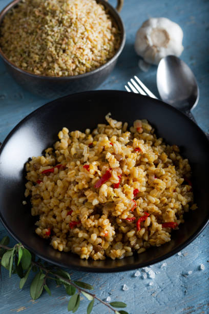 istock Bulgur pilaf with lentil (green, red and yellow) and vegetable. 1294325857