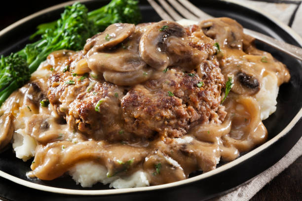 istock Salisbury Steak in a Rich Mushroom and Onion Gravy with Mashed Potatoes 1294326053