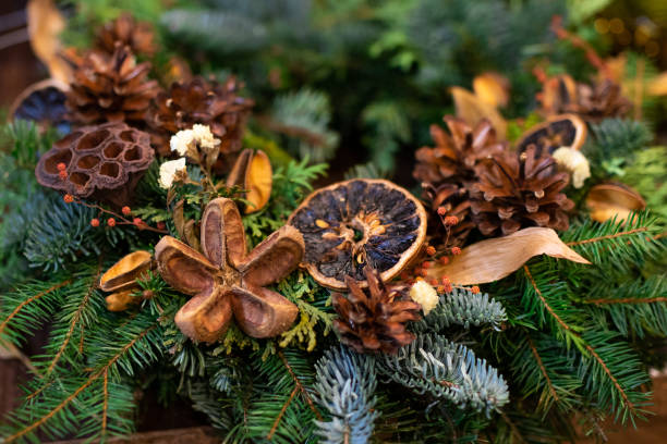 istock Christmas wreath decorated with cones and dry elements close up 1294327040