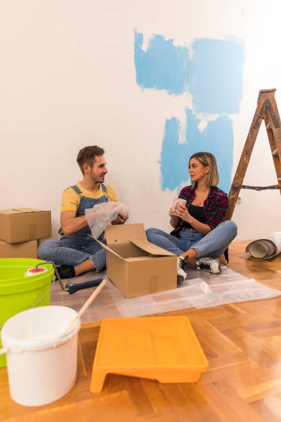 istock Couple talking and unpacking in their new home 1294327055