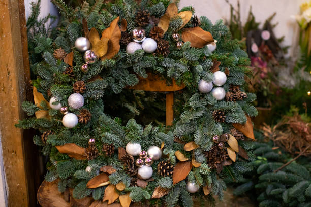istock Christmas wreath decorated with silver balls, cones and dry elements 1294327056