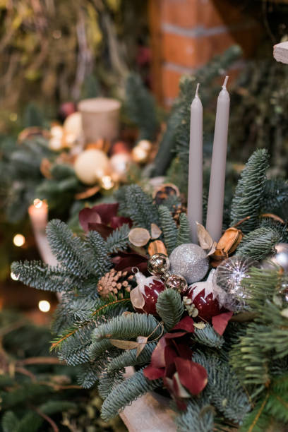 istock Christmas tree branch decorated with balls, cones and candles 1294327908