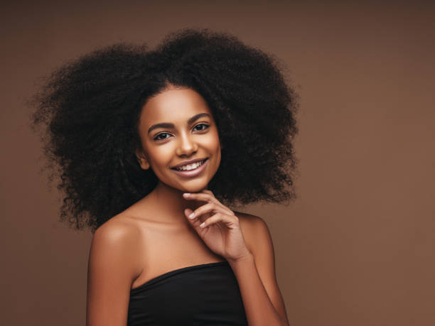 istock Beautiful smiling girl with curly hairstyle 1294328530