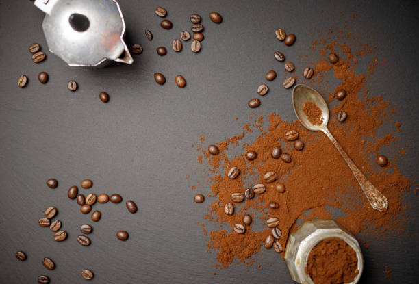 istock coffee pot with a spoon and roasted coffee beans 1294329575