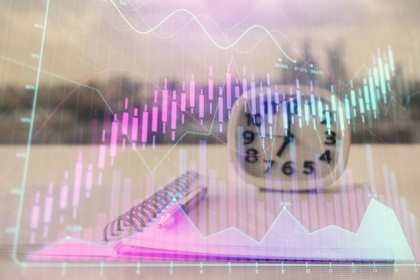 istock Double exposure of financial graph drawings and desk with open notebook background. Concept of forex market 1294333939