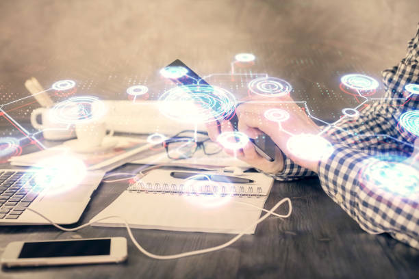 istock Double exposure of man's hands holding and using a phone and social network theme drawing. 1294333983