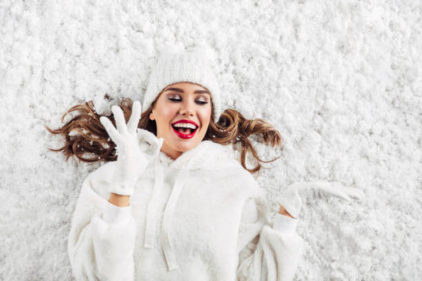 Girl lying down on the snow