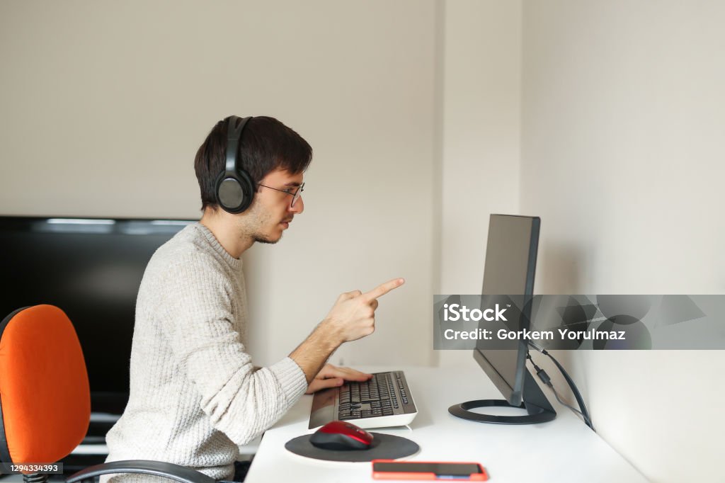 Business man analyzing Desktop PC Stock Photo