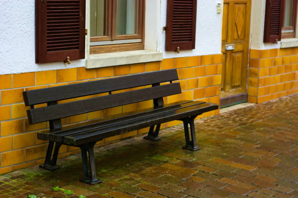 istock Park bench near a haus. 1294335157