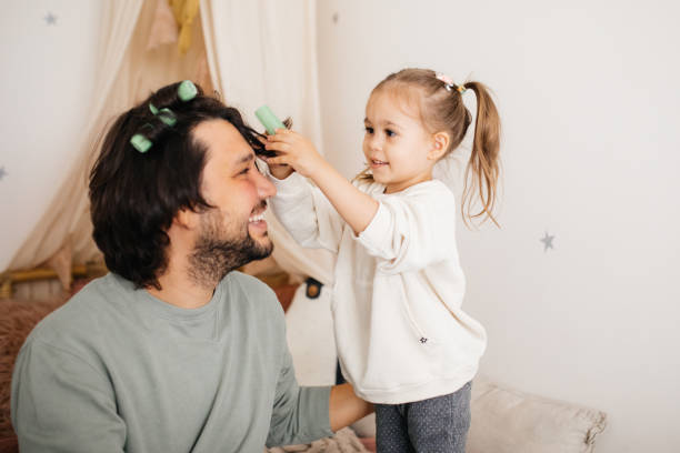 istock Dad with daughter hav fun at home 1294336334