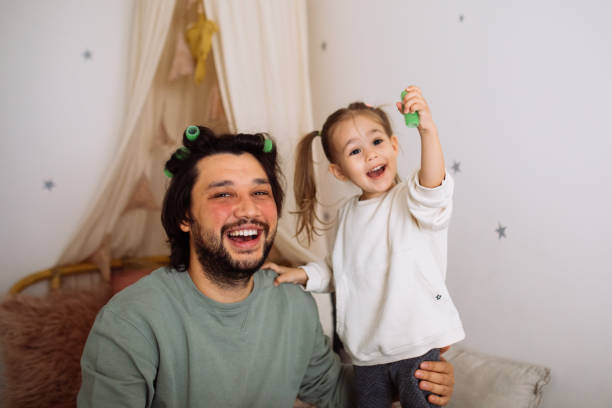 istock Dad with daughter hav fun at home 1294336441