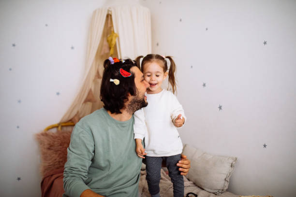 istock Dad with daughter hav fun at home 1294337403