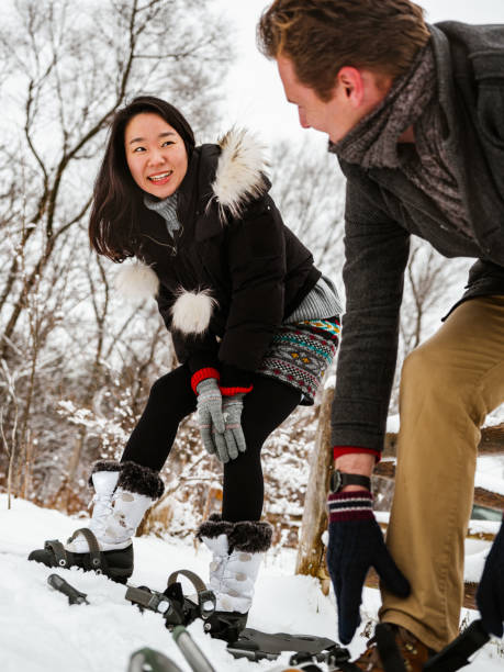 istock Mixed race couple snowshoeing in winter 1294337524