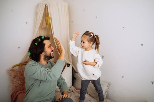 istock Dad with daughter hav fun at home 1294337600