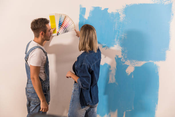 istock Comparing if the wall shade matches the color swatches 1294337607