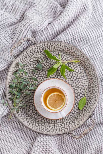 istock Healthy detox ginger and sage tea with lemon on tray 1294337610