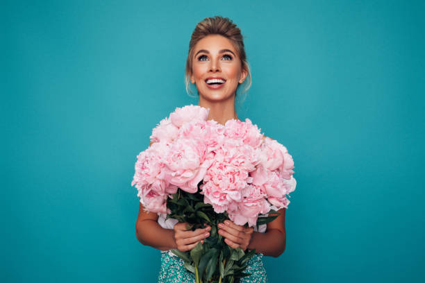 istock Beautiful woman with flowers 1294339227