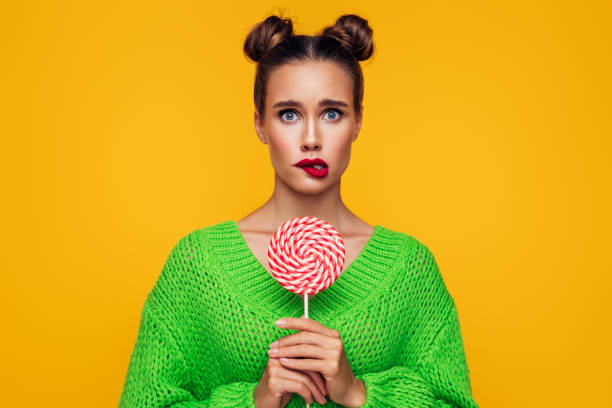 Beautiful woman with big lollipop