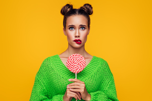 Beautiful woman with big lollipop