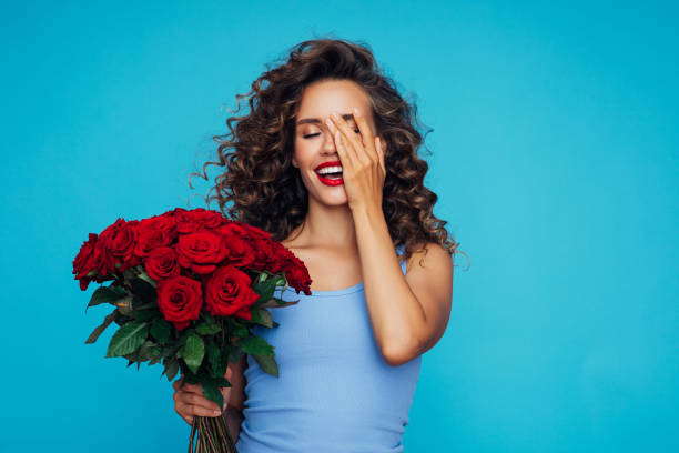 istock Beautiful woman with flowers 1294340361