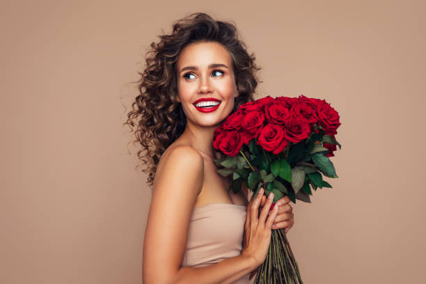 istock Beautiful woman with flowers 1294340393