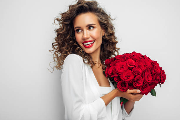 istock Beautiful woman with flowers 1294340401