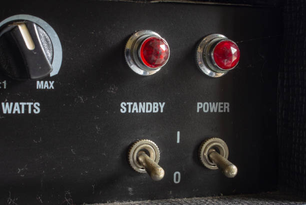 istock Buttons, knobs and lights of a guitar amplifier 1294343017