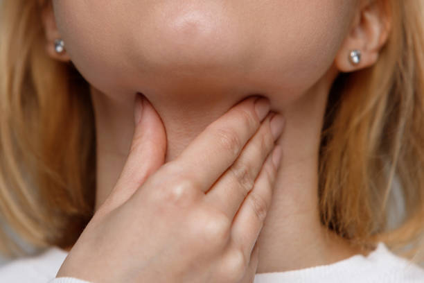 istock woman suffering from throat problems. Thyroid gland, painful swallowing 1294344871