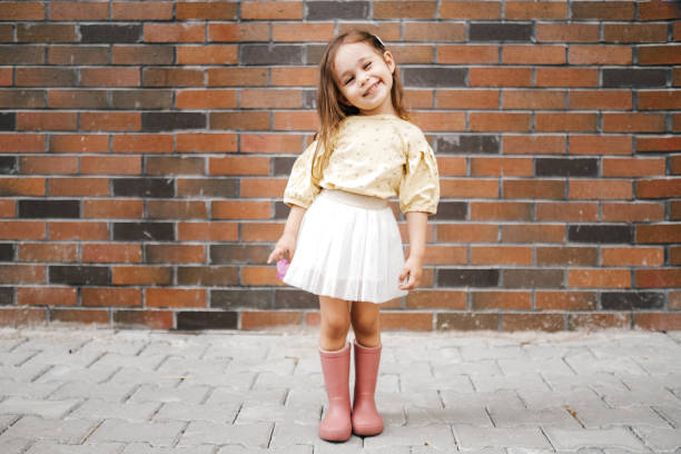 Cute little girl having fun time in the nature Cute little girl posing skirt stock pictures, royalty-free photos & images