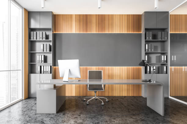 istock Gray and wooden panoramic CEO office interior 1294345727