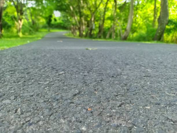 istock paved roads leading up the hill 1294347400