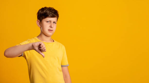 istock dislike gesture disappointed kid wrong choice boy 1294349096