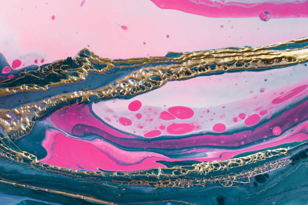 istock Gold wave bubbles on mixing green and pink paints. Fluid Art. Marble effect background or texture 1294349162