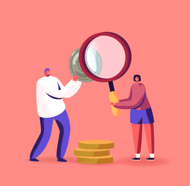 istock Tiny Numismatist Collectors Examine Silver and Golden Coins with Huge Magnifying Glass. People Collect Ancient Coins 1294349740