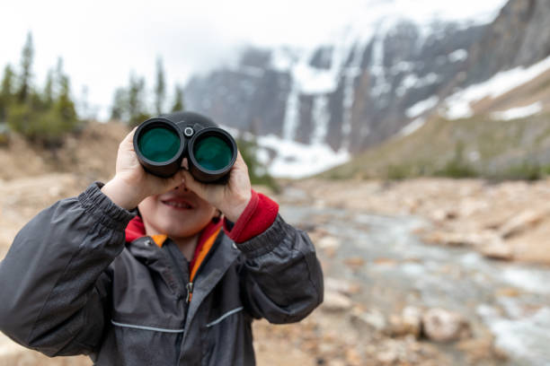 istock Young Boy Avalanche Watching with Binoculars at Mount Edith Cavell, Alberta, Canada 1294350130