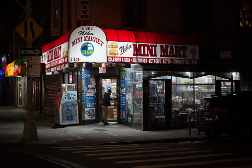 Queens, New York. January 02, 2021. A man enters a bodega in Jackson Heights.