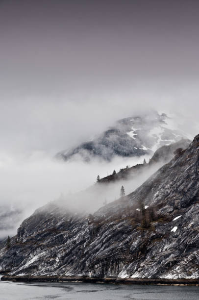 istock Alaskan Mountains with Clouds, Purple Sky 1294359724