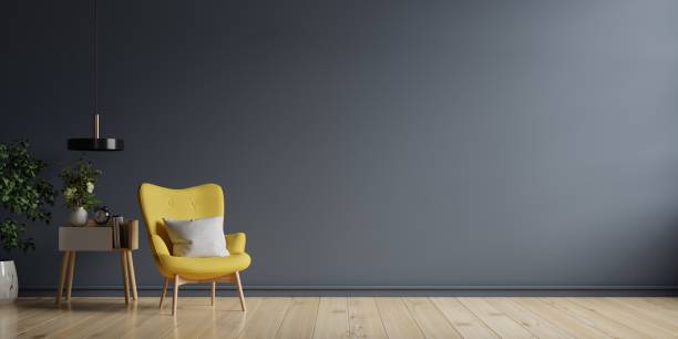 istock The interior has a yellow armchair on empty dark wall background. 1294360544