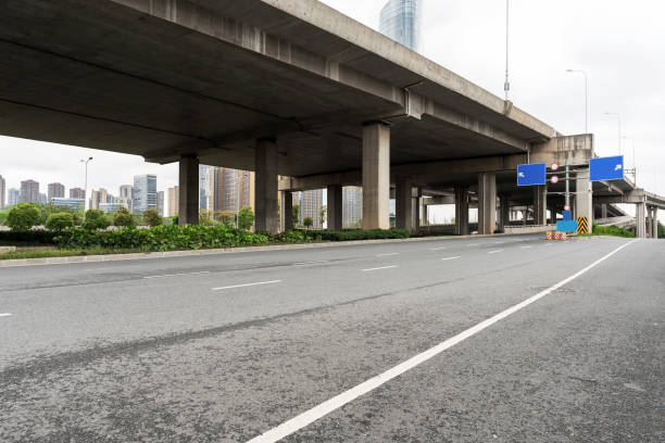 istock Concrete structure and asphalt road space under the overpass in the city 1294362875