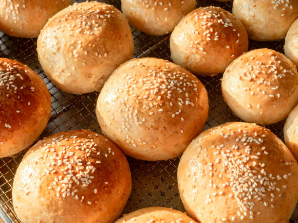 istock Fresh homemade burger buns with sesame seed. 1294365532