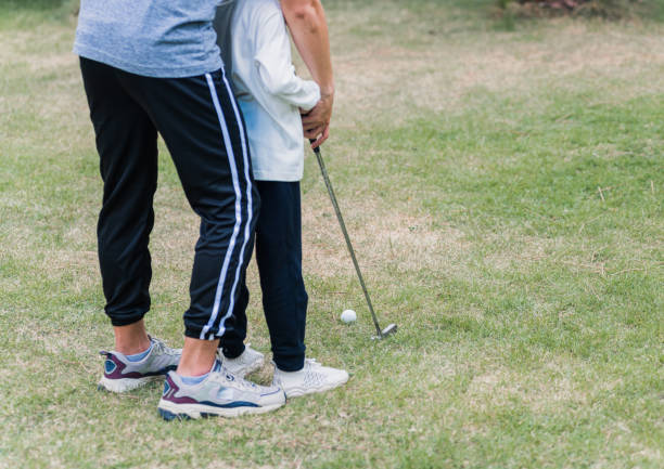 istock father support teaching training daughter to play perfect golf 1294367183